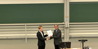 Dr. Joshua Mornhinweg receiving the prize.